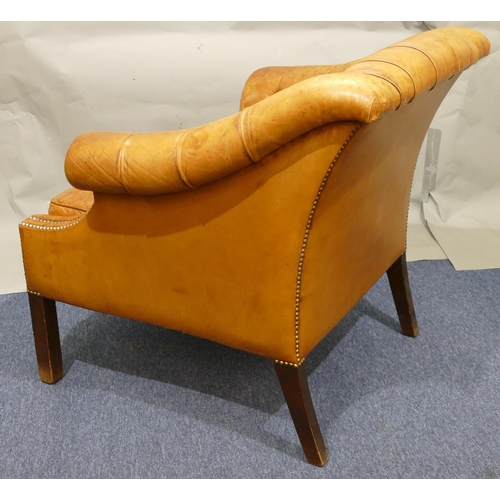 873 - A mahogany framed and brown leather armchair with buttoned back, sides and studded decoration, leath... 