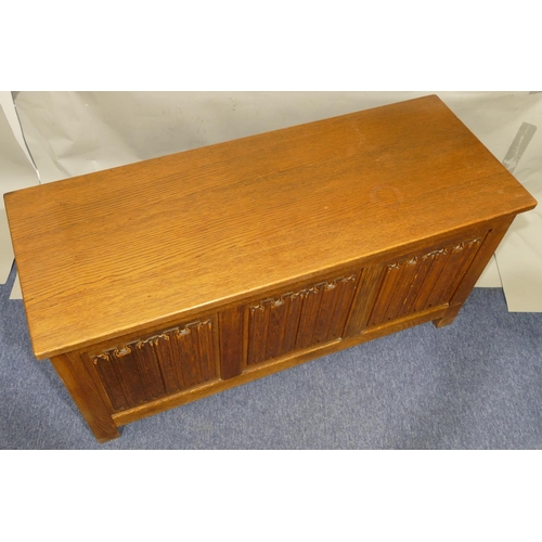 877 - A good quality oak 20th Century blanket box with hinged lid, triple carved panelled front, on stile ... 