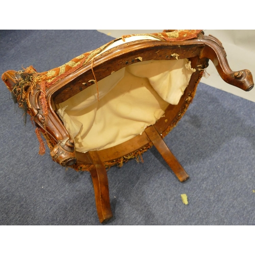 880 - A Victorian walnut spoon back armchair with allover pierced and raised carved floral, leaf and scrol... 