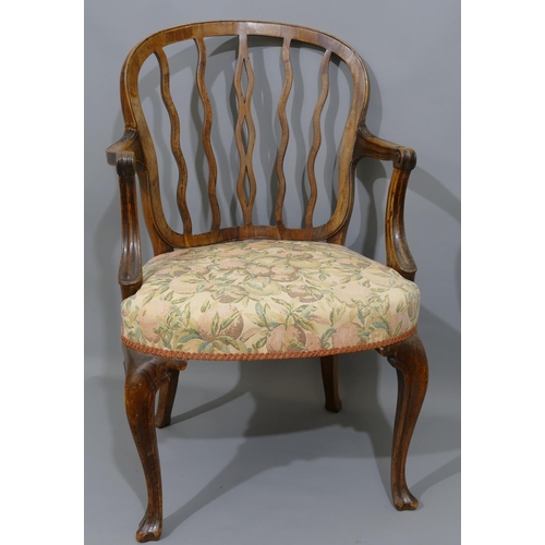 893 - A 19th Century carving chair with wavy stick back, coloured fruit overstuffed seat on cabriole legs.