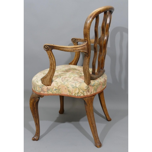 893 - A 19th Century carving chair with wavy stick back, coloured fruit overstuffed seat on cabriole legs.