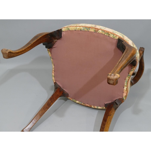 893 - A 19th Century carving chair with wavy stick back, coloured fruit overstuffed seat on cabriole legs.