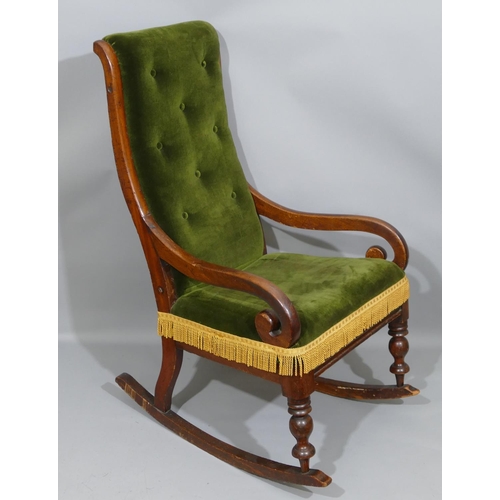 899 - An 19th Century mahogany rocking chair with green velvet over stuffed seat and button back, 58cm wid... 