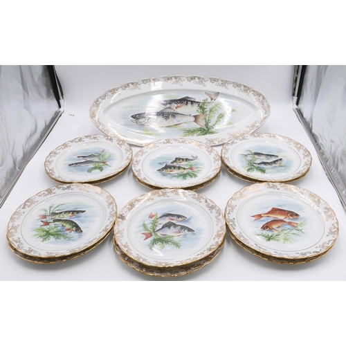 9 - A Limoges fish service on white and gilt ground with multi-coloured varying fish motifs, 1 oval serv... 