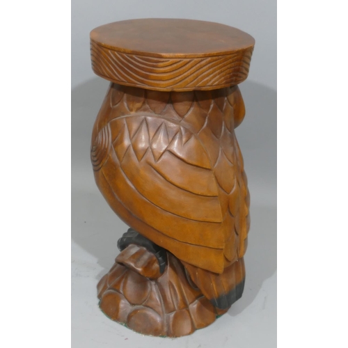 907 - A 20th Century carved wooden stool in the form of an owl, 51cm high