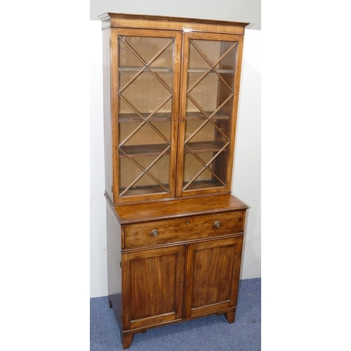 901 - A small George III mahogany bookcase with 2 astrical glazed doors above 1 long drawer, 2 panel doors... 