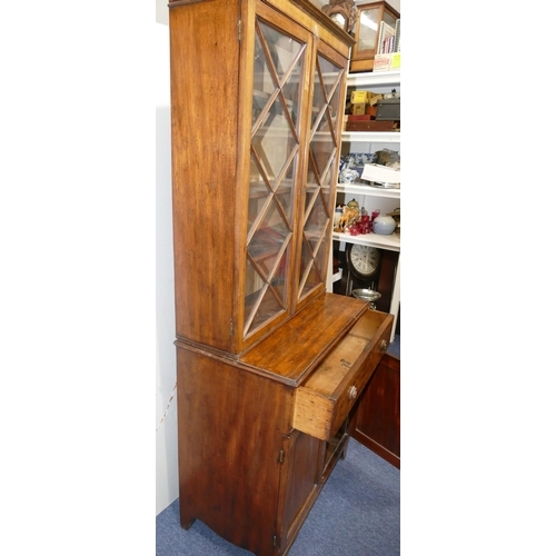 901 - A small George III mahogany bookcase with 2 astrical glazed doors above 1 long drawer, 2 panel doors... 