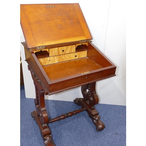 903 - A 19th Century mahogany Davenport with lipped back, sloping hinged front enclosing pigeon holes and ... 