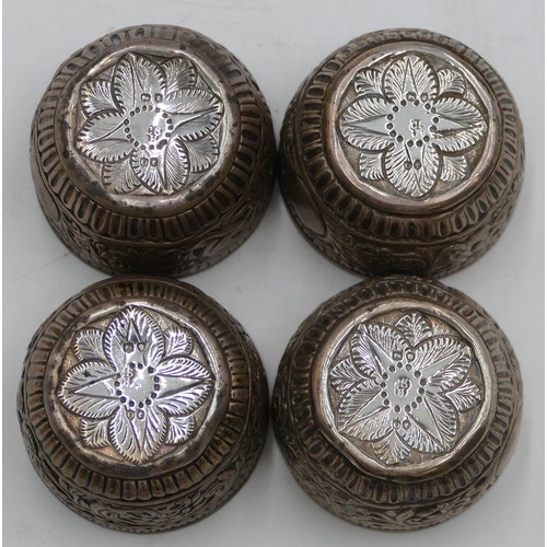 272 - A set of 4 Victorian silver round salts with clear glass liners with embossed floral and leaf decora... 