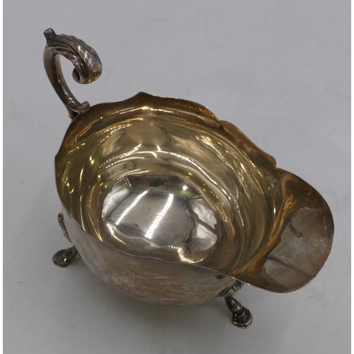 271 - A Chester silver round sauce boat with crinkled rim, scrolled handle and splayed hoof feet 6.2oz