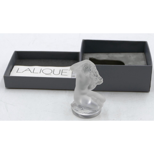 105 - A frosted glass small Lalique figure of a kneeling female nude playing with her hair, 8cm high, sign... 