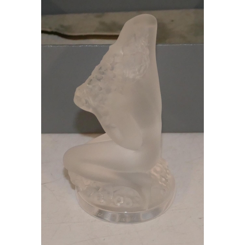 105 - A frosted glass small Lalique figure of a kneeling female nude playing with her hair, 8cm high, sign... 