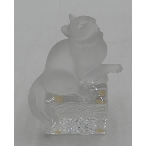 106 - A Lalique frosted glass figure of a seated cat on plinth, 15cm high, signed.