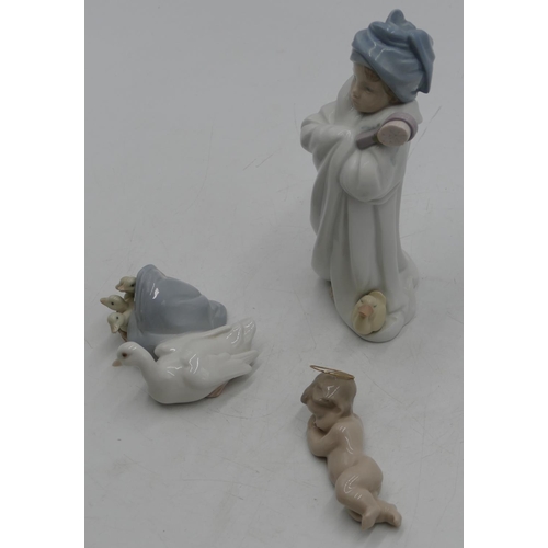 111 - A Lladro group of duck with ducklings, 10cm wide, a small Lladro figure of a sleeping child and a Ll... 