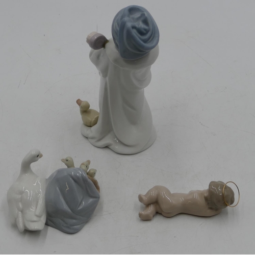 111 - A Lladro group of duck with ducklings, 10cm wide, a small Lladro figure of a sleeping child and a Ll... 