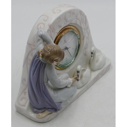 113 - A Lladro clock with raised figure of a seated young lady with 2 swans, Arabic numerals and seconds h... 