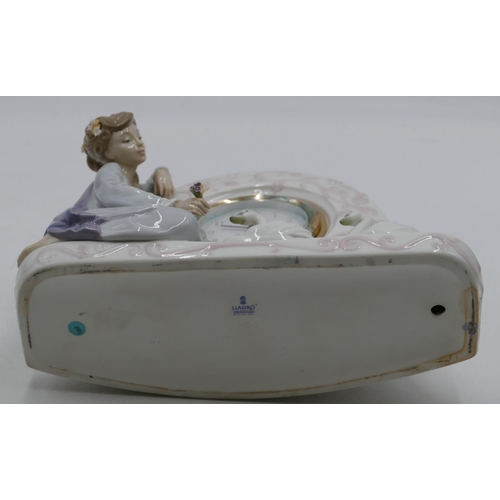 113 - A Lladro clock with raised figure of a seated young lady with 2 swans, Arabic numerals and seconds h... 