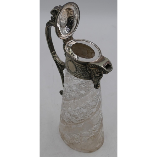 156 - A heavy oval cut glass claret jug with silver-plated neck, handle and hinged lid with mask head and ... 