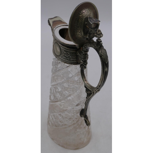 156 - A heavy oval cut glass claret jug with silver-plated neck, handle and hinged lid with mask head and ... 