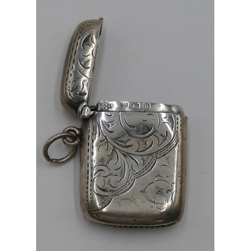 175 - A small Birmingham silver Vesta case with chased decoration and hinged lid, 3.8 cm high.