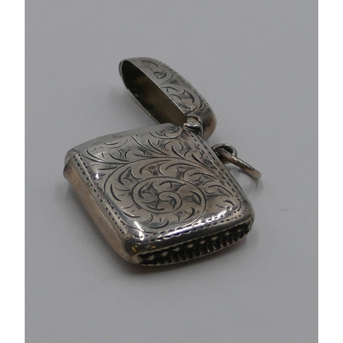 175 - A small Birmingham silver Vesta case with chased decoration and hinged lid, 3.8 cm high.