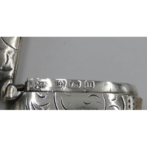 175 - A small Birmingham silver Vesta case with chased decoration and hinged lid, 3.8 cm high.