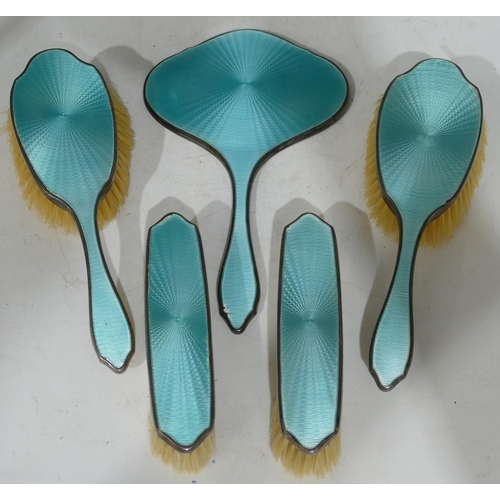 179 - A Birmingham silver 5-piece turquoise enamelled dressing table set, 1 hand mirror and 4 brushes (sli... 