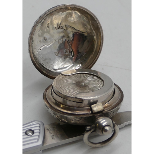 188 - A Chester silver round bulbous shaped sovereign case with hinged top and allover etched scroll decor... 