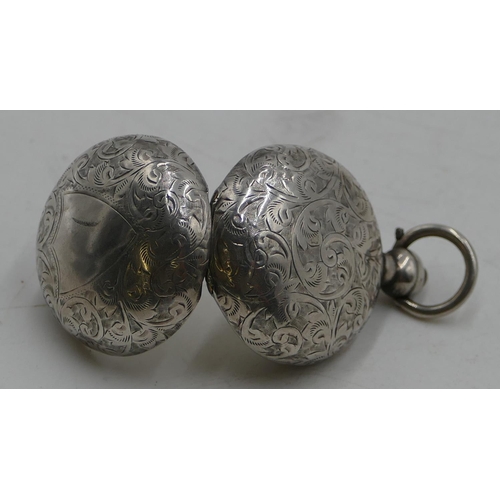 188 - A Chester silver round bulbous shaped sovereign case with hinged top and allover etched scroll decor... 