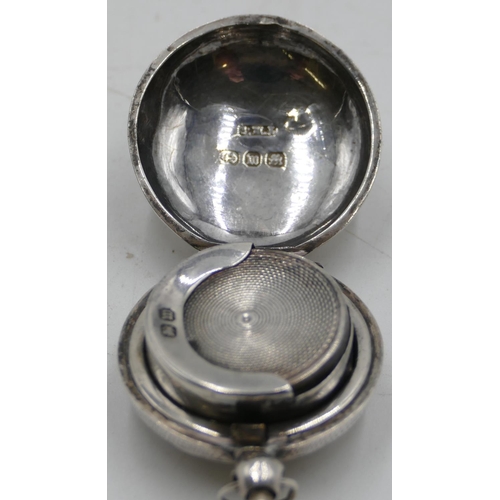 190 - A Birmingham silver round bulbous shaped sovereign case with hinged front and etched floral and leaf... 