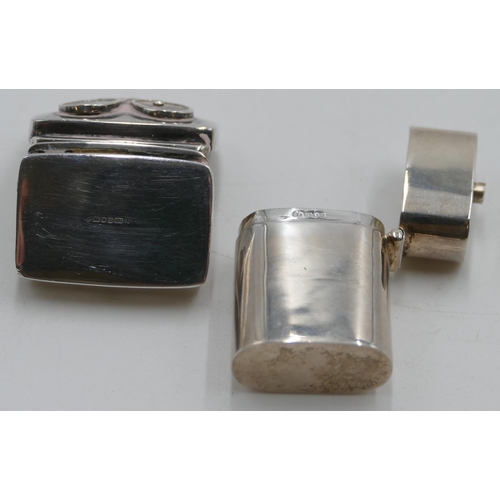 192 - A modern London plain oblong silver pill box with hinged lid, sliding release to top, 3.8cm high and... 