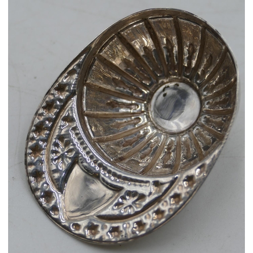 193 - A modern Sheffield silver caddy spoon in form of a cap with embossed decoration.