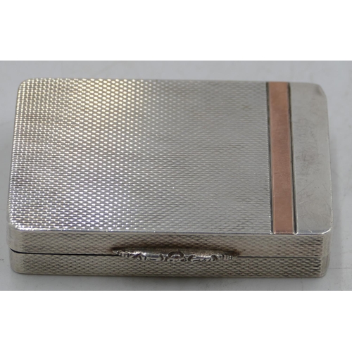 199 - A modern London silver rectangular shaped snuff box with allover engine turn decoration and hinged l... 