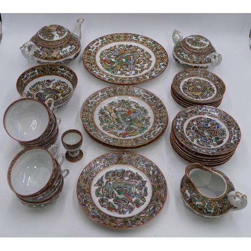 2 - A 20th Century Chinese eggshell tea service on white ground with multi coloured butterfly decoration... 