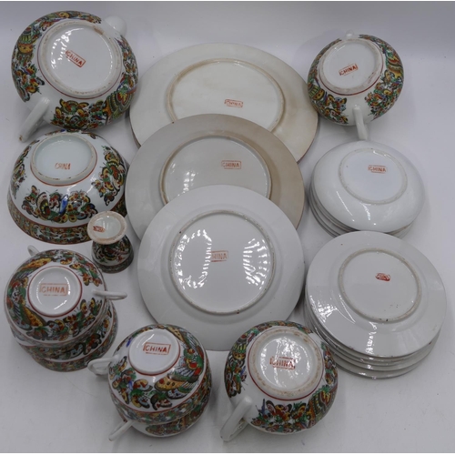 2 - A 20th Century Chinese eggshell tea service on white ground with multi coloured butterfly decoration... 