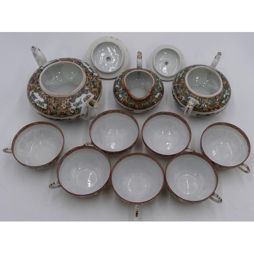 2 - A 20th Century Chinese eggshell tea service on white ground with multi coloured butterfly decoration... 