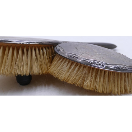 208 - A Birmingham silver hand mirror and matching hair brush with engraved ribbon, swag and scroll decora... 