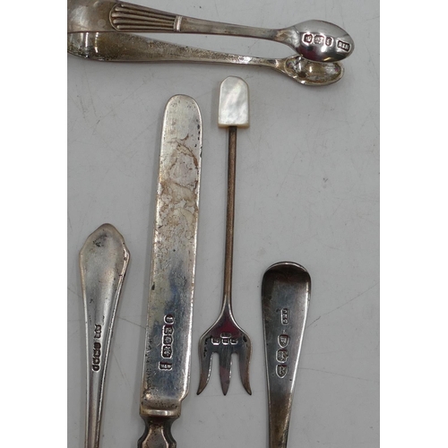 212 - A George V child's knife and fork, Sheffield 1934, maker Mappin and Webb, a London silver tea spoon,... 