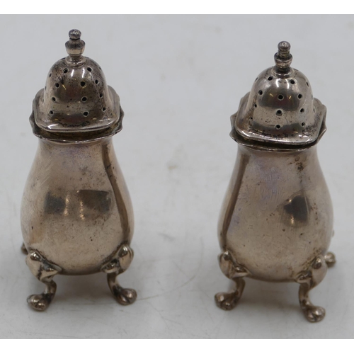 214 - A pair of Birmingham square silver bulbous shaped pepper pots on splayed feet, 2.3oz.