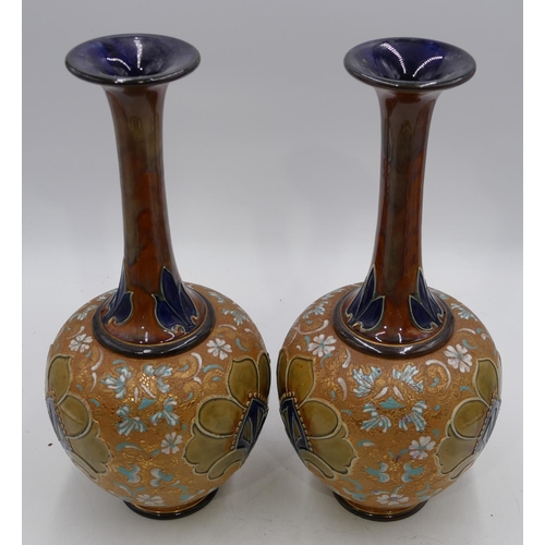 22 - A pair of Royal Doulton and Slater round bulbous thin necked trumpet shaped vases on brown and green... 