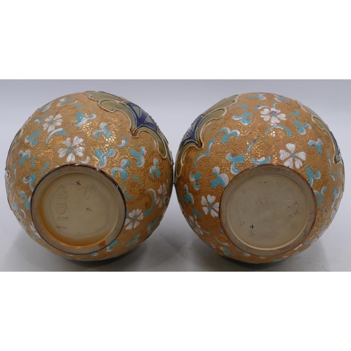 22 - A pair of Royal Doulton and Slater round bulbous thin necked trumpet shaped vases on brown and green... 