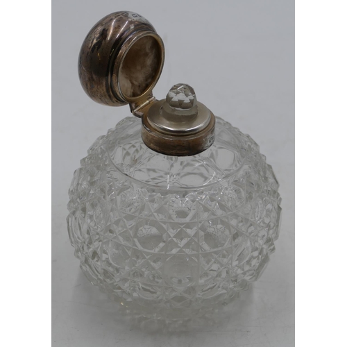 227 - A cut glass round bulbous shaped scent bottle with Birmingham silver neck and hinged lid enclosing i... 