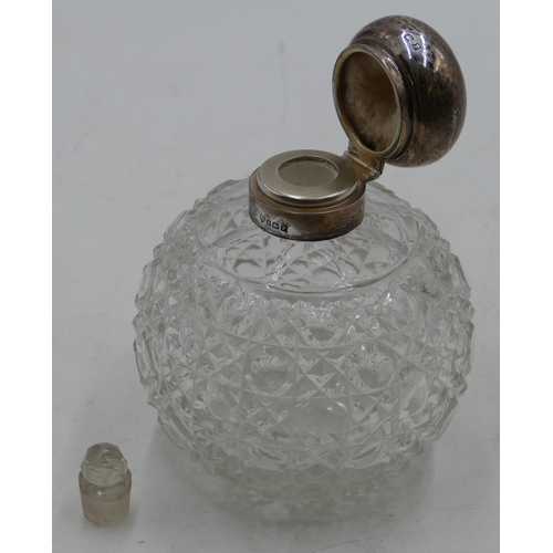 227 - A cut glass round bulbous shaped scent bottle with Birmingham silver neck and hinged lid enclosing i... 