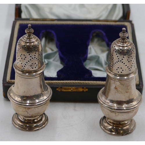 229 - A pair of Edward VII silver round bulbous shaped pepper pots, Birmingham 1902, makers mark A & L Ltd... 