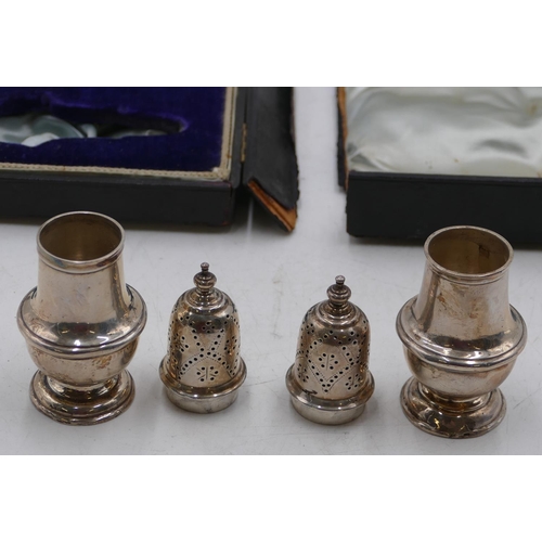 229 - A pair of Edward VII silver round bulbous shaped pepper pots, Birmingham 1902, makers mark A & L Ltd... 