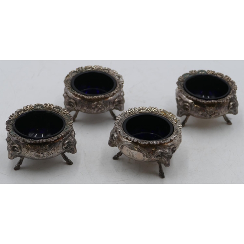 232 - A set of 4 George V silver round bulbous shaped salts with crinkled rims, embossed floral and leaf d... 