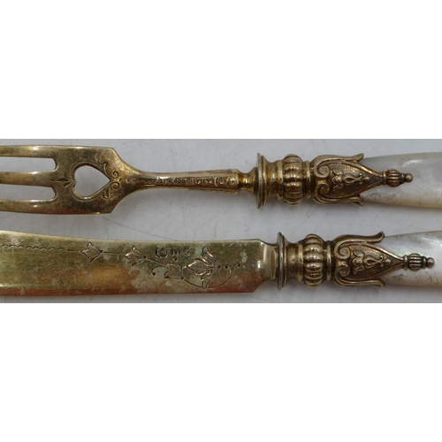 233 - A set of 12 800 silver gilt coloured metal fish knives  with Mother of Pearl handles and 12 matching... 