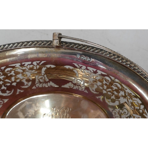 236 - A Sheffield silver oval cake basket with swing overhead handle, allover pierced leaf and scroll deco... 