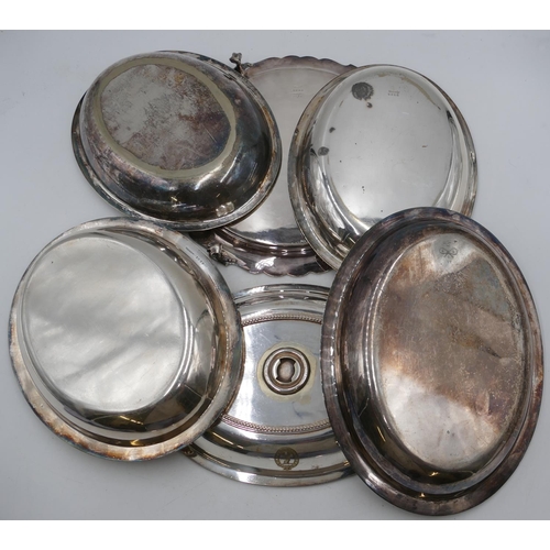 243 - A pair of silver-plated oval lidded entrée dishes with raised ball rims, a similar entrée dish with ... 