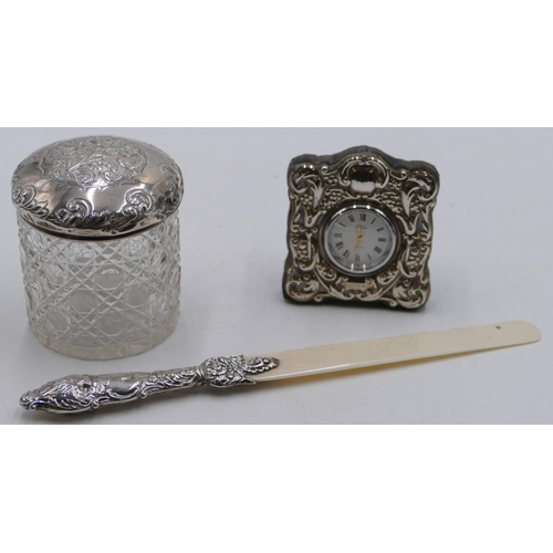 244 - A Chester silver handled paper knife with embossed cupid, floral and scroll decoration with plastic ... 